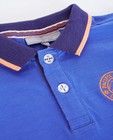 Polos - Blauwe polo met oranje logo