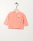 Roze vest van biokatoen - met pompons - Newborn 50-68