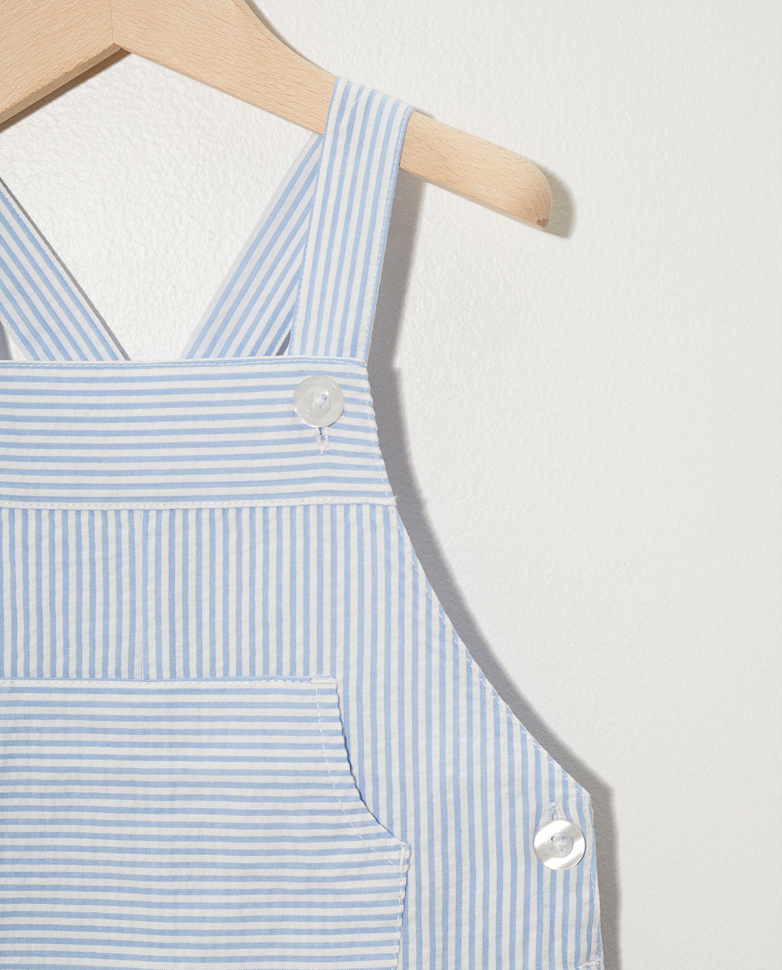 Shorts - Salopette blanche à rayures bleues
