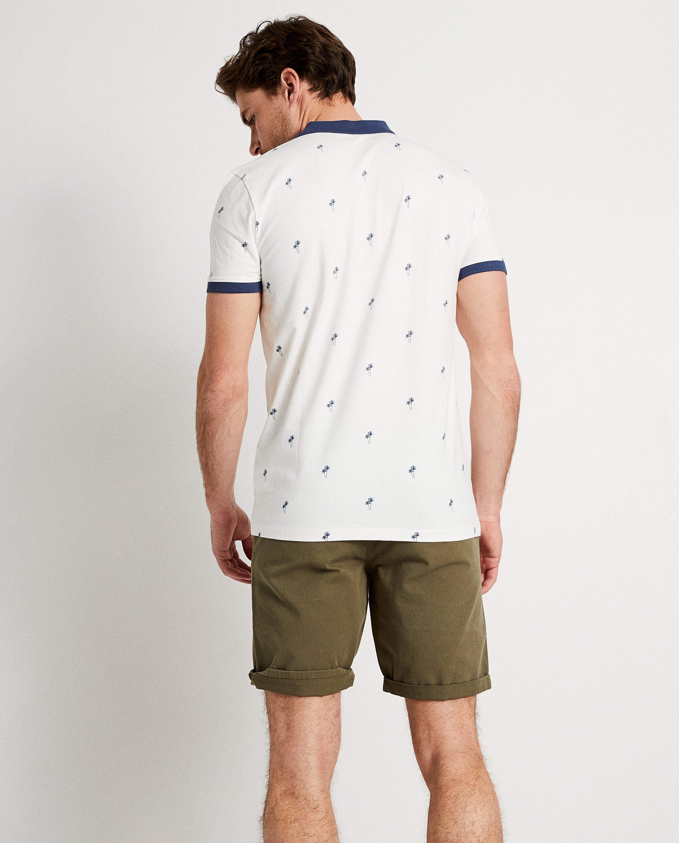Polo's - Witte polo met palmboomprint