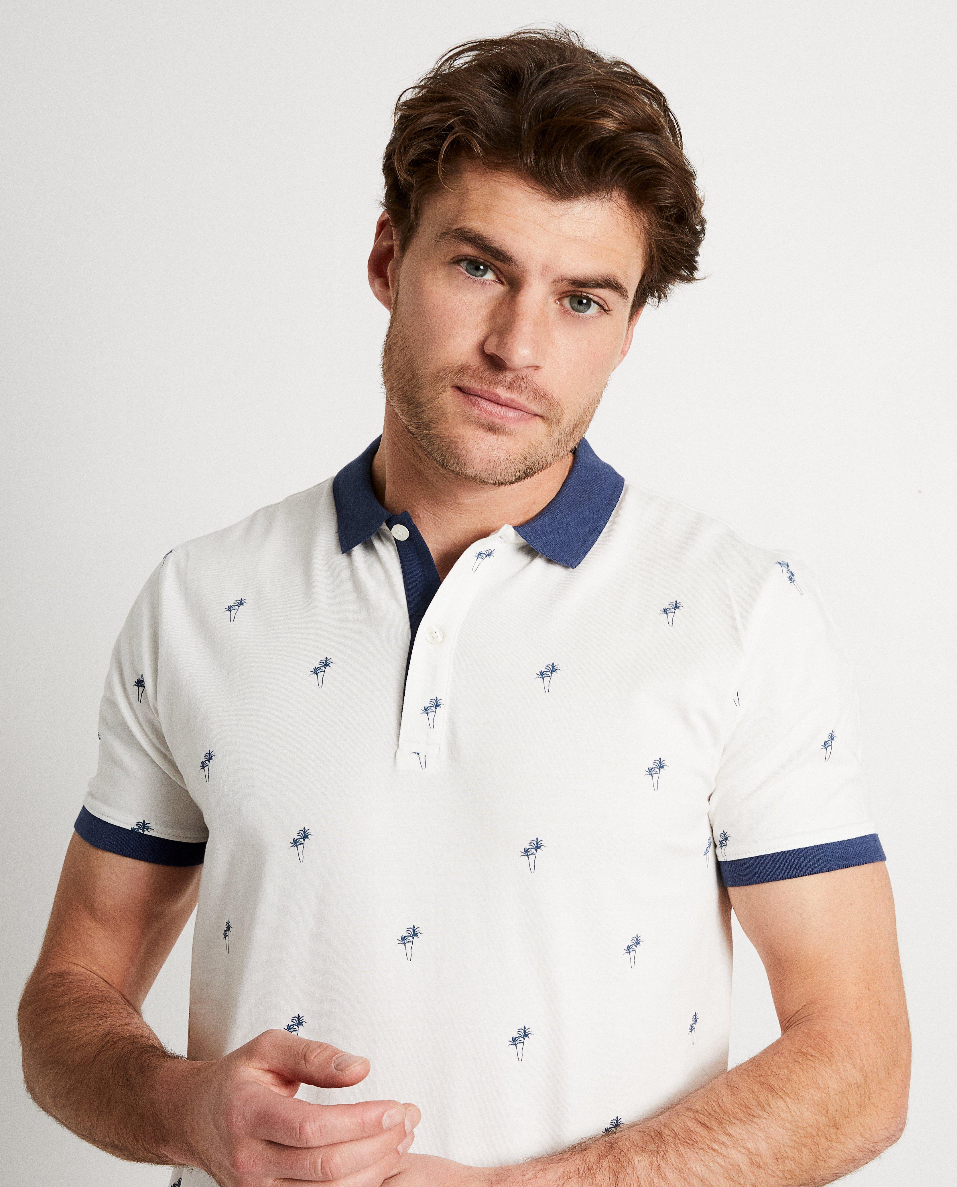 Polo's - Witte polo met palmboomprint