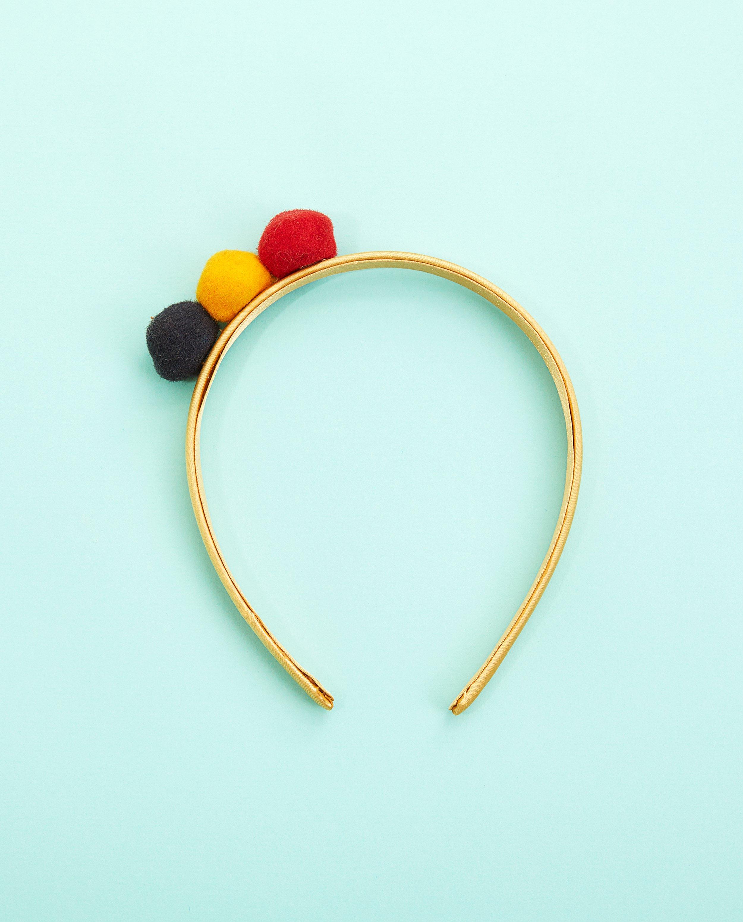 Geel diadeempje met pompon - blauw, geel en rood - Milla Star