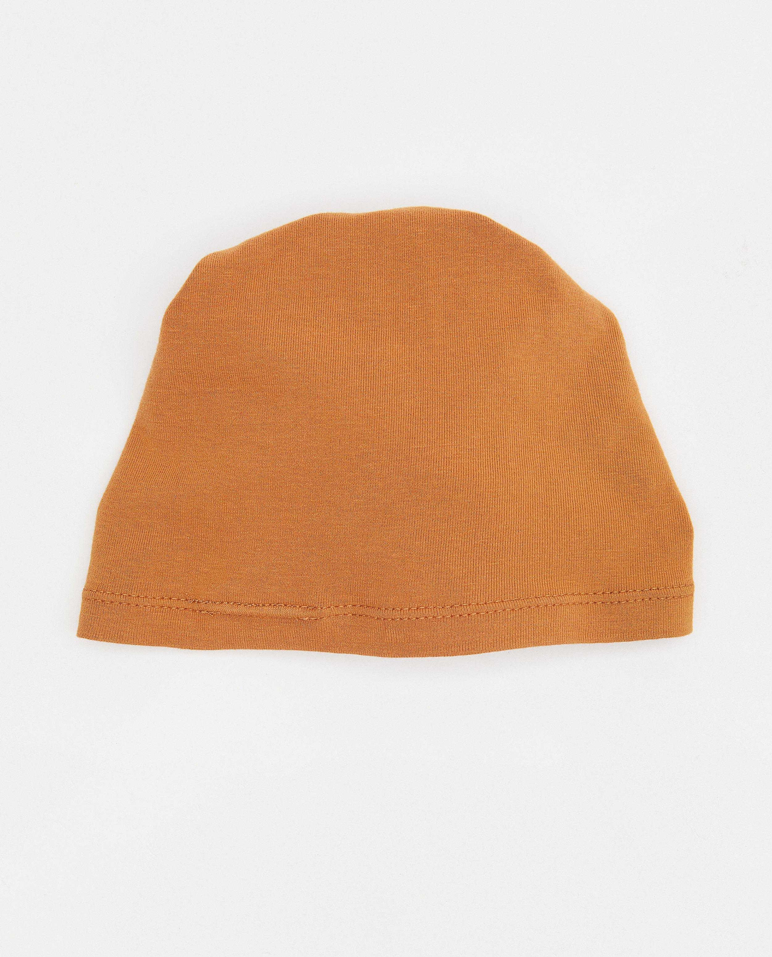 Bonneterie - Petit bonnet en coton bio avec une fleur