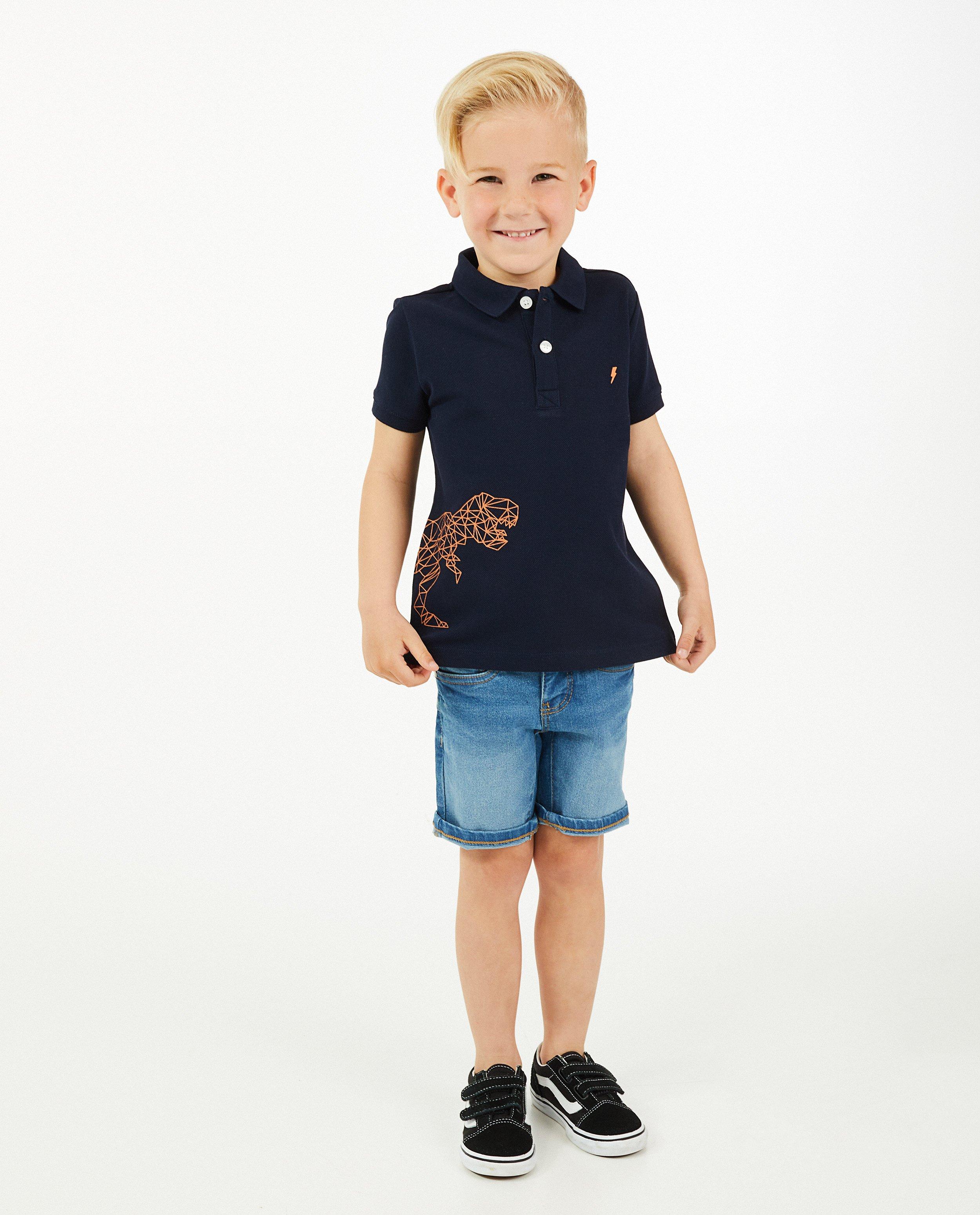 Polo bleu avec un imprimé à dinos - sur le côté - Kidz Nation