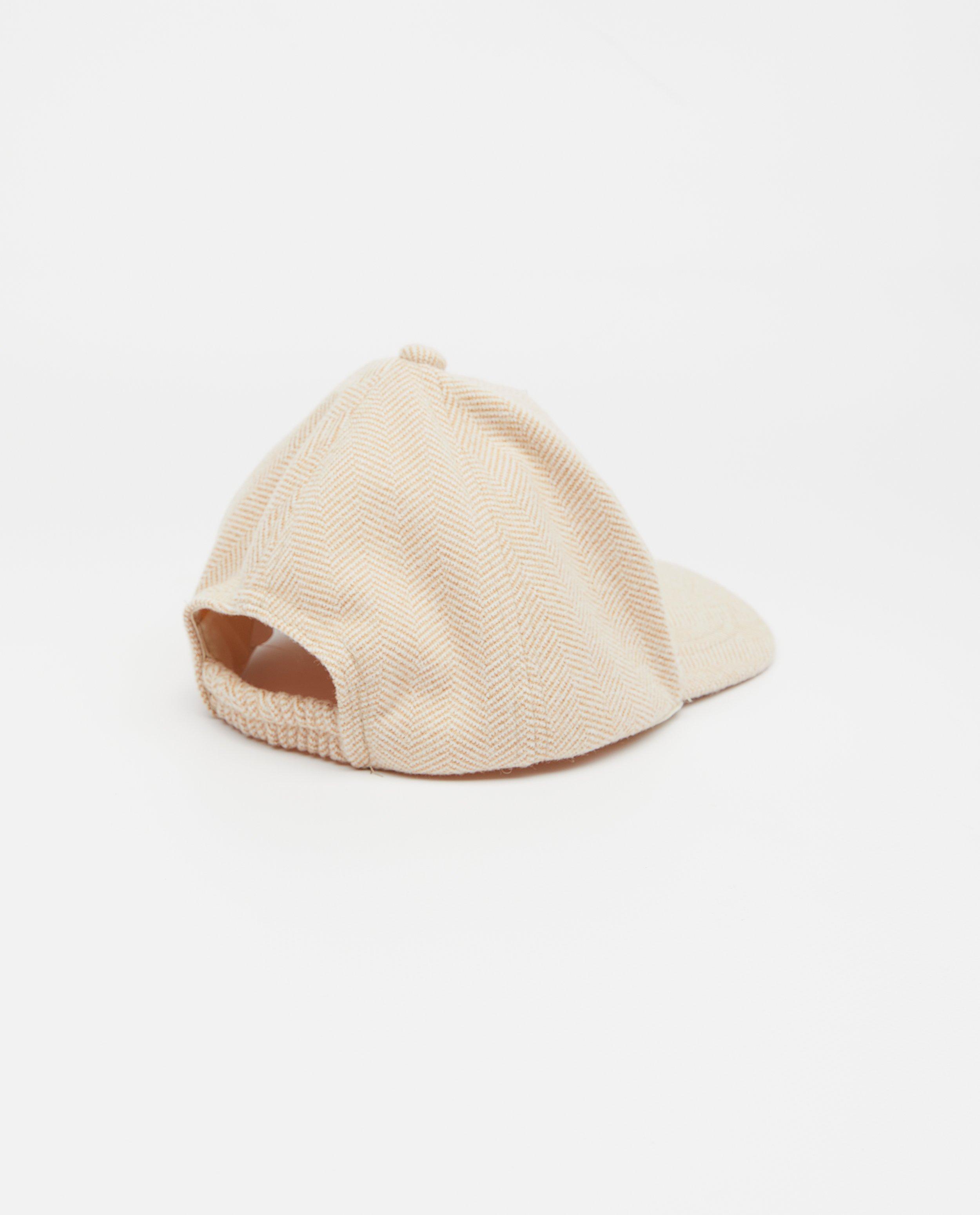 Breigoed - Beige pet met patch