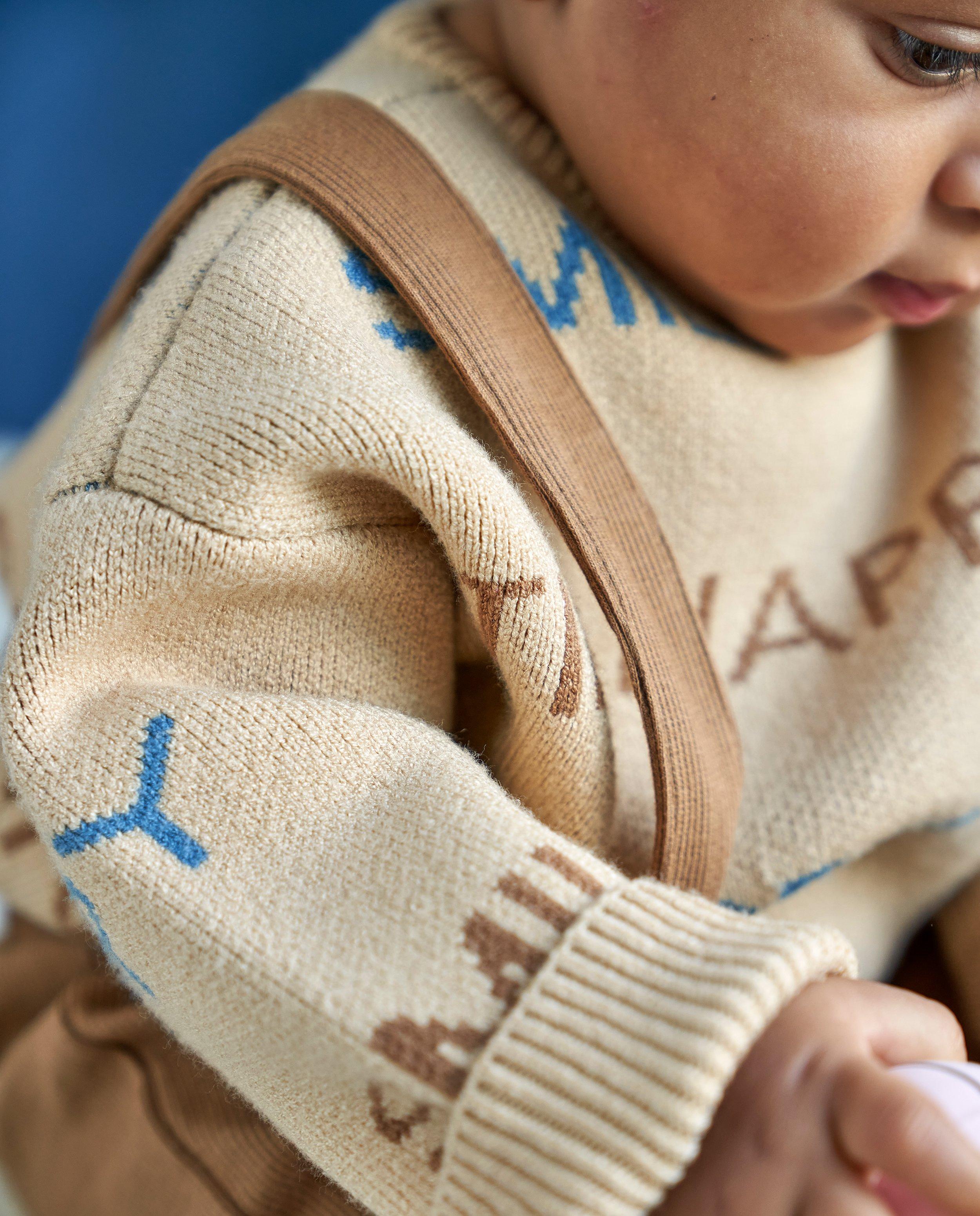 Truien - Beige trui met opschrift