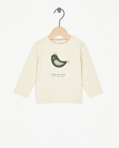 T-shirt beige à manches longues avec un oiseau