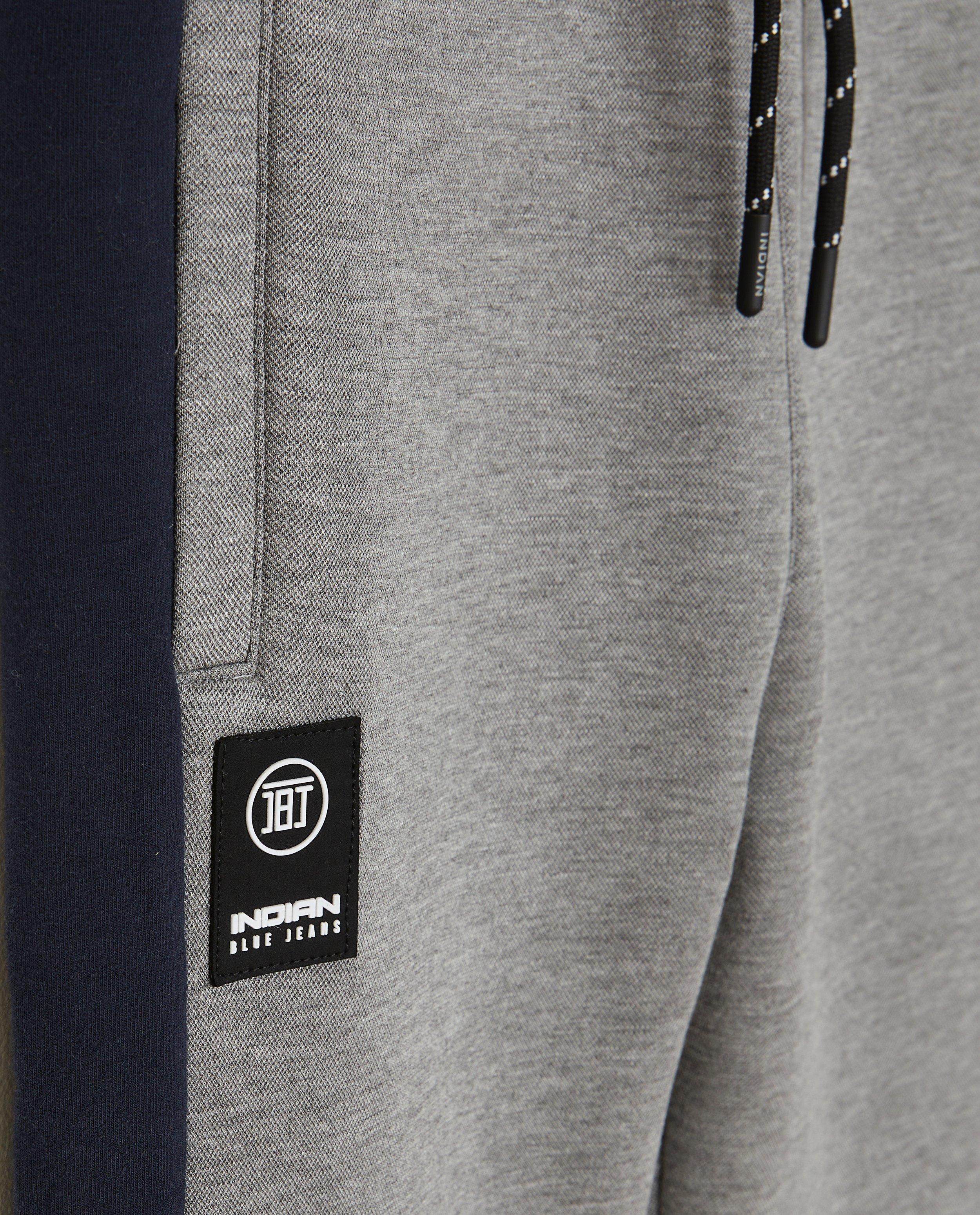 Broeken - Grijze joggingbroek met sierbiezen