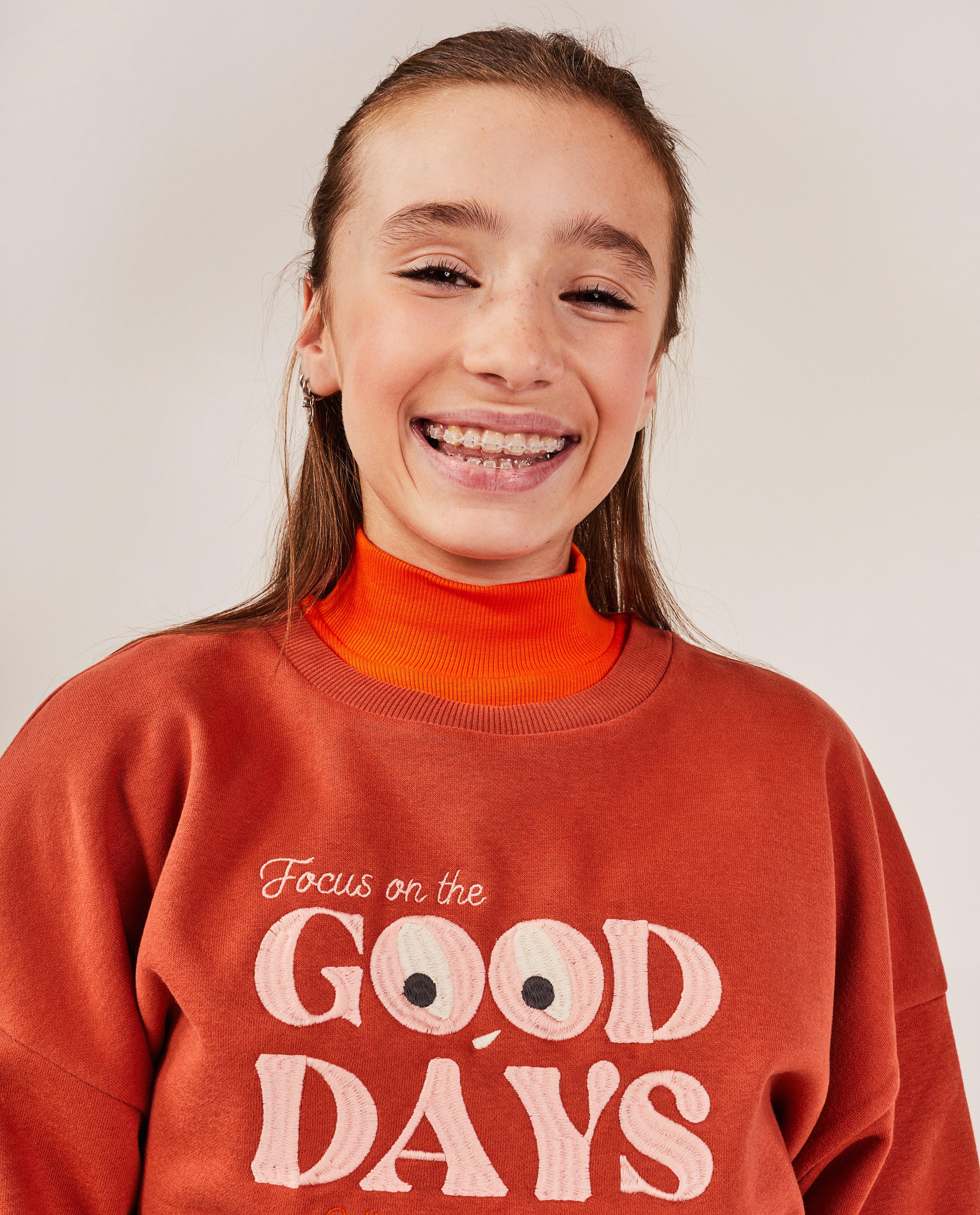 Sweaters - Oranje sweater met opschrift