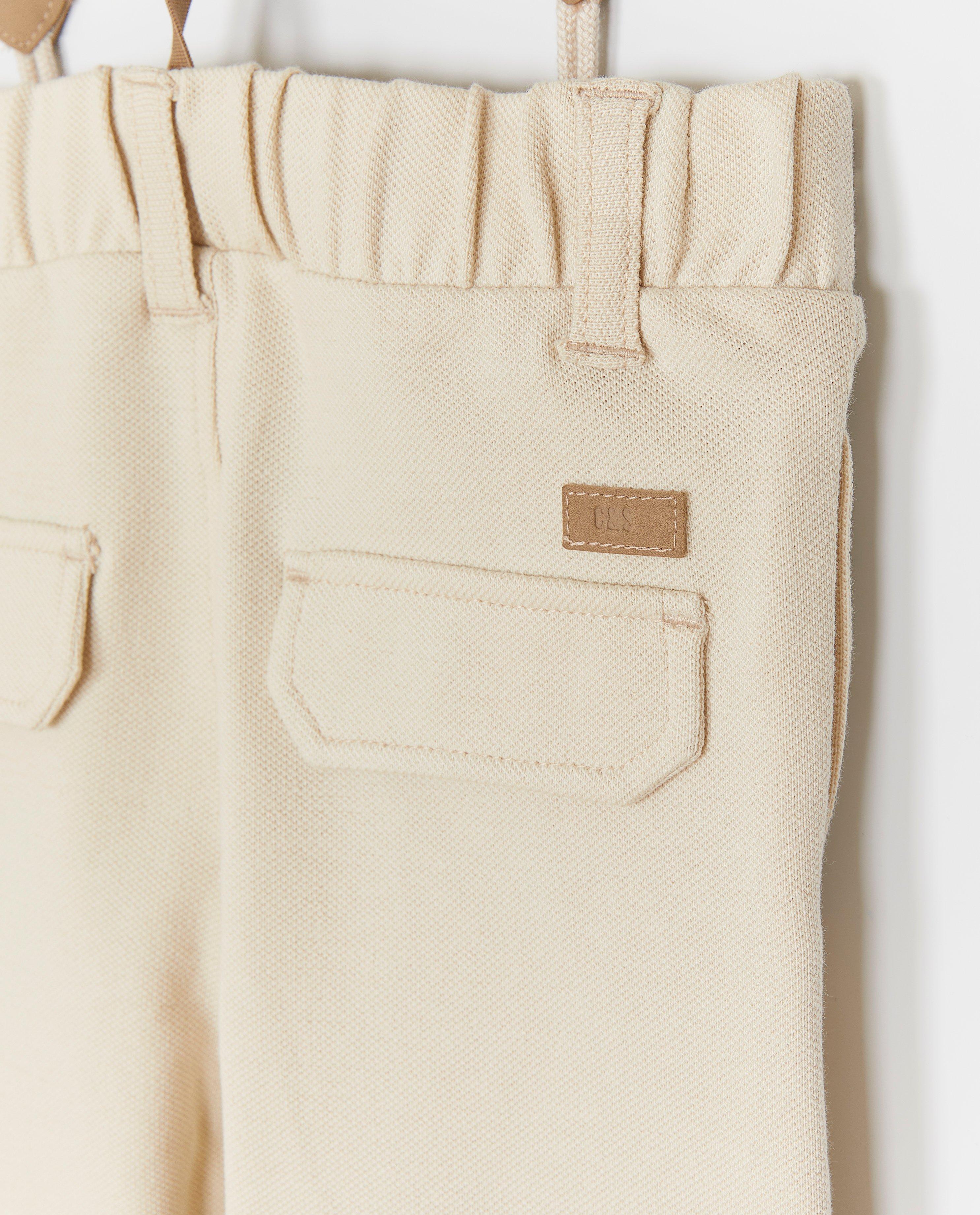 Broeken - Beige broek met bretellen