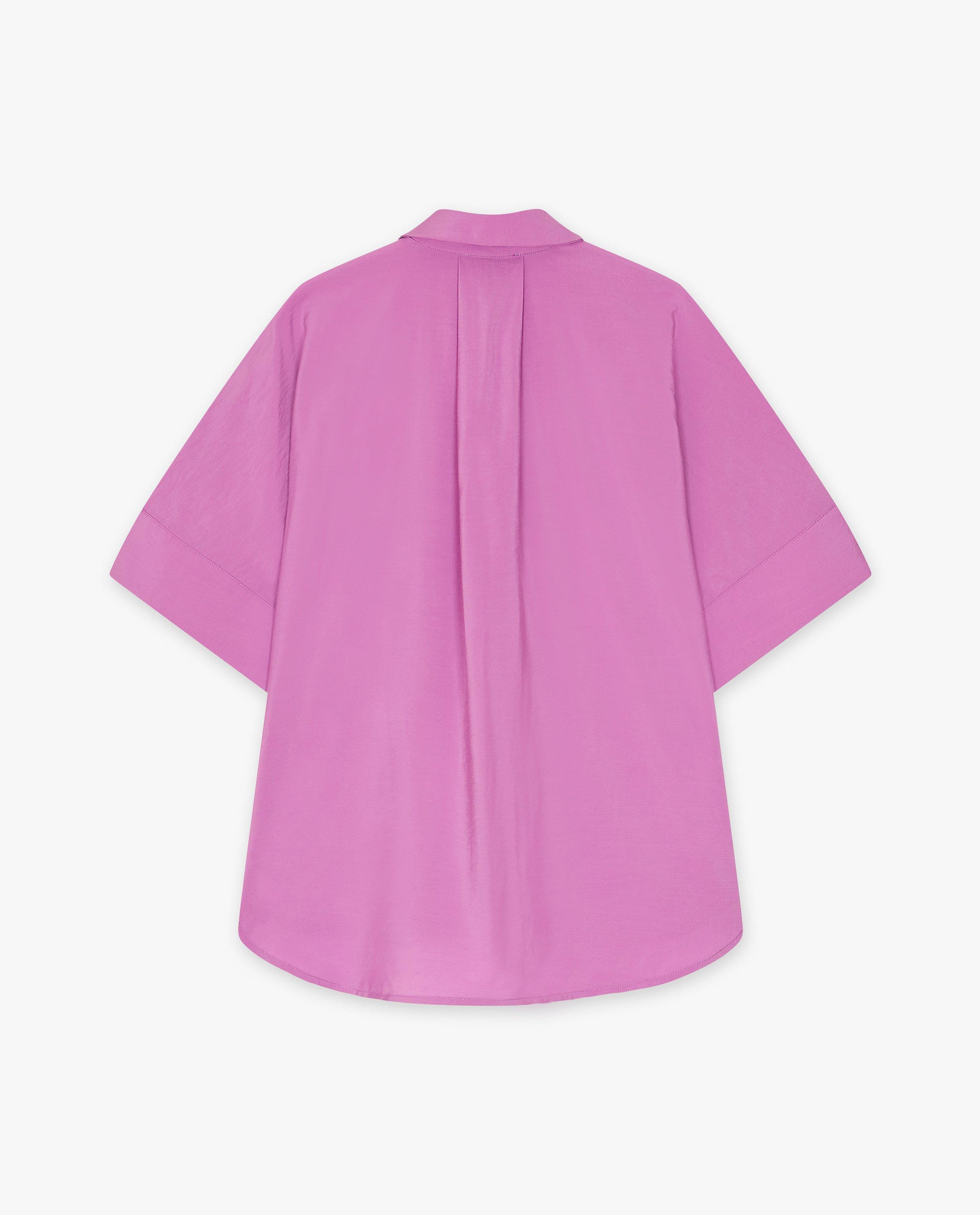 Chemises - Blouse avec une fleur brodée