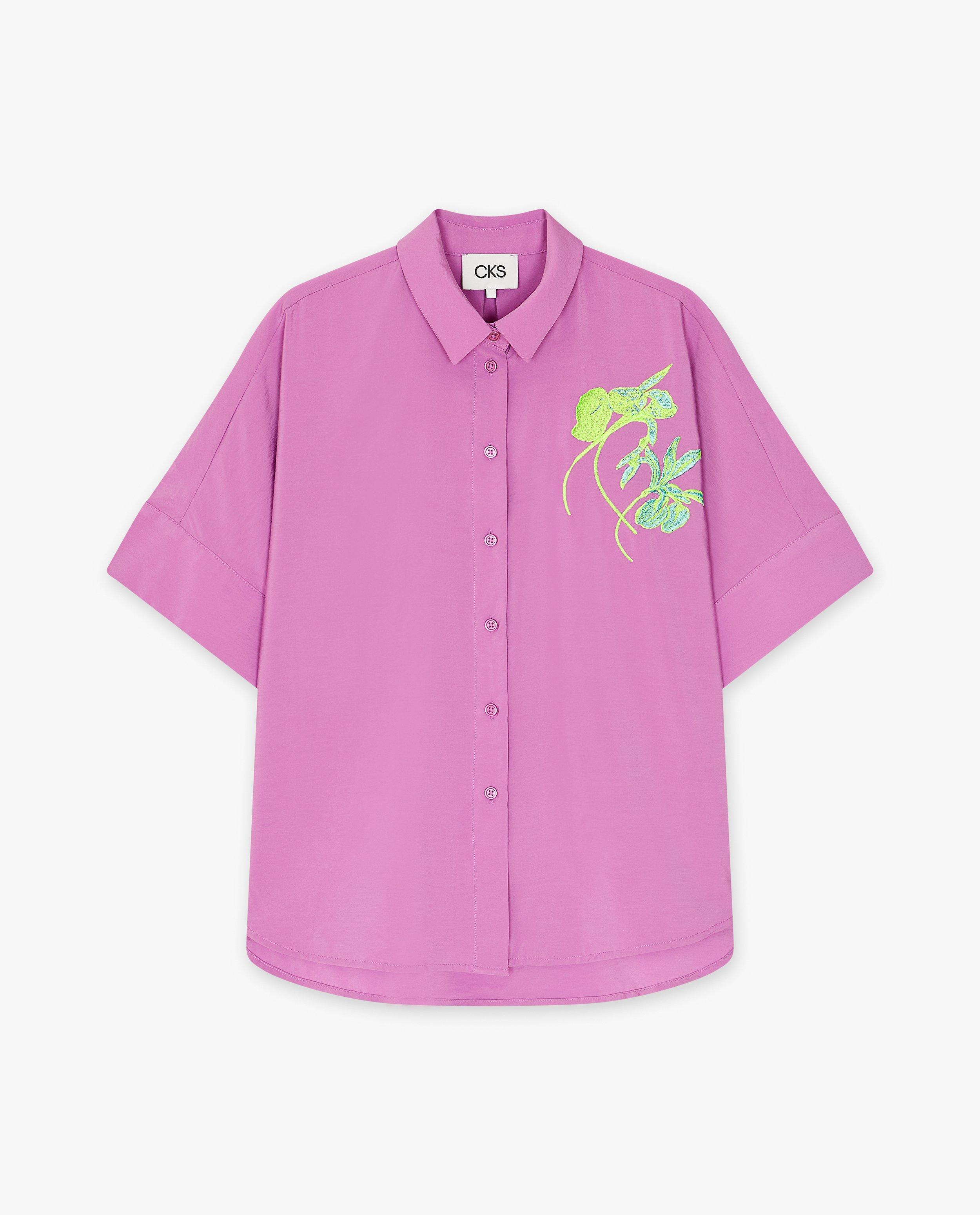 Chemises - Blouse avec une fleur brodée