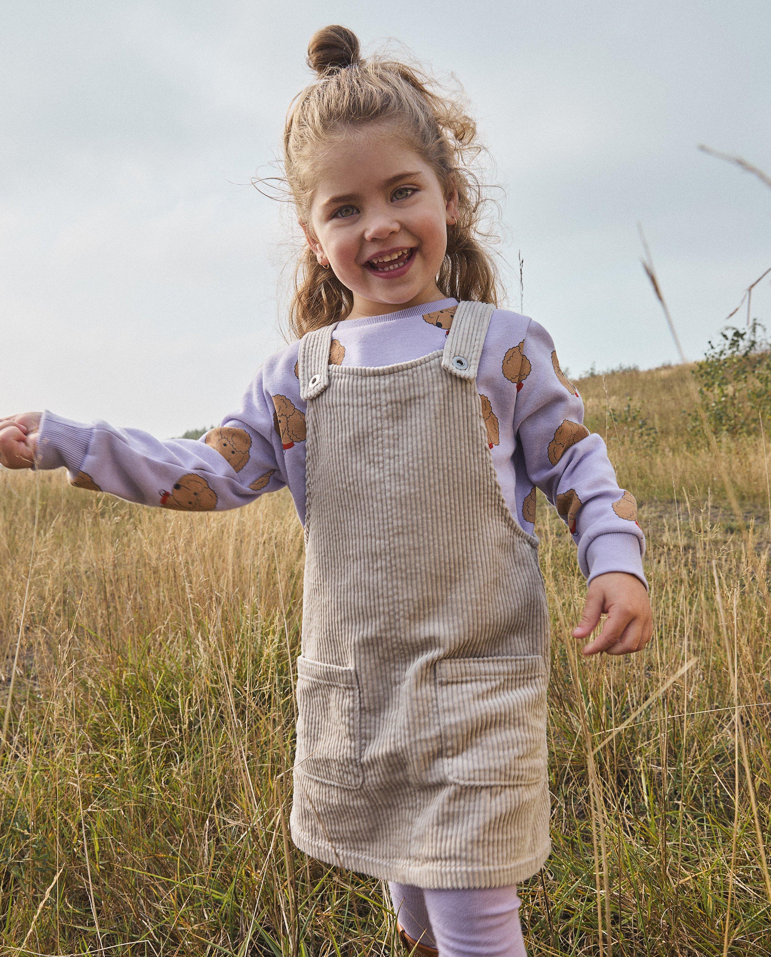 Robe-salopette en velours côtelé