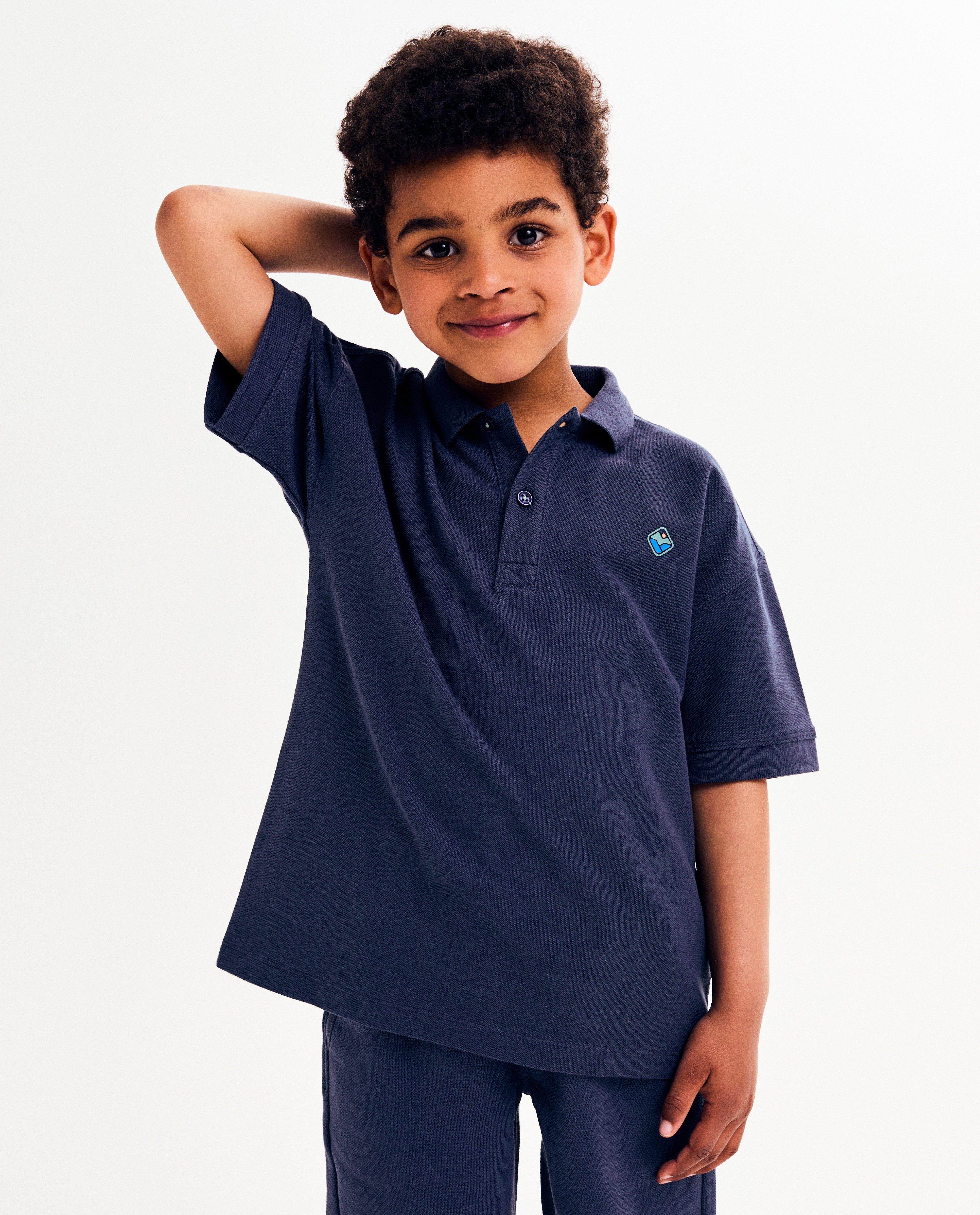 Polo met kleine reliëfprint, loose fit - null - Kidz Nation