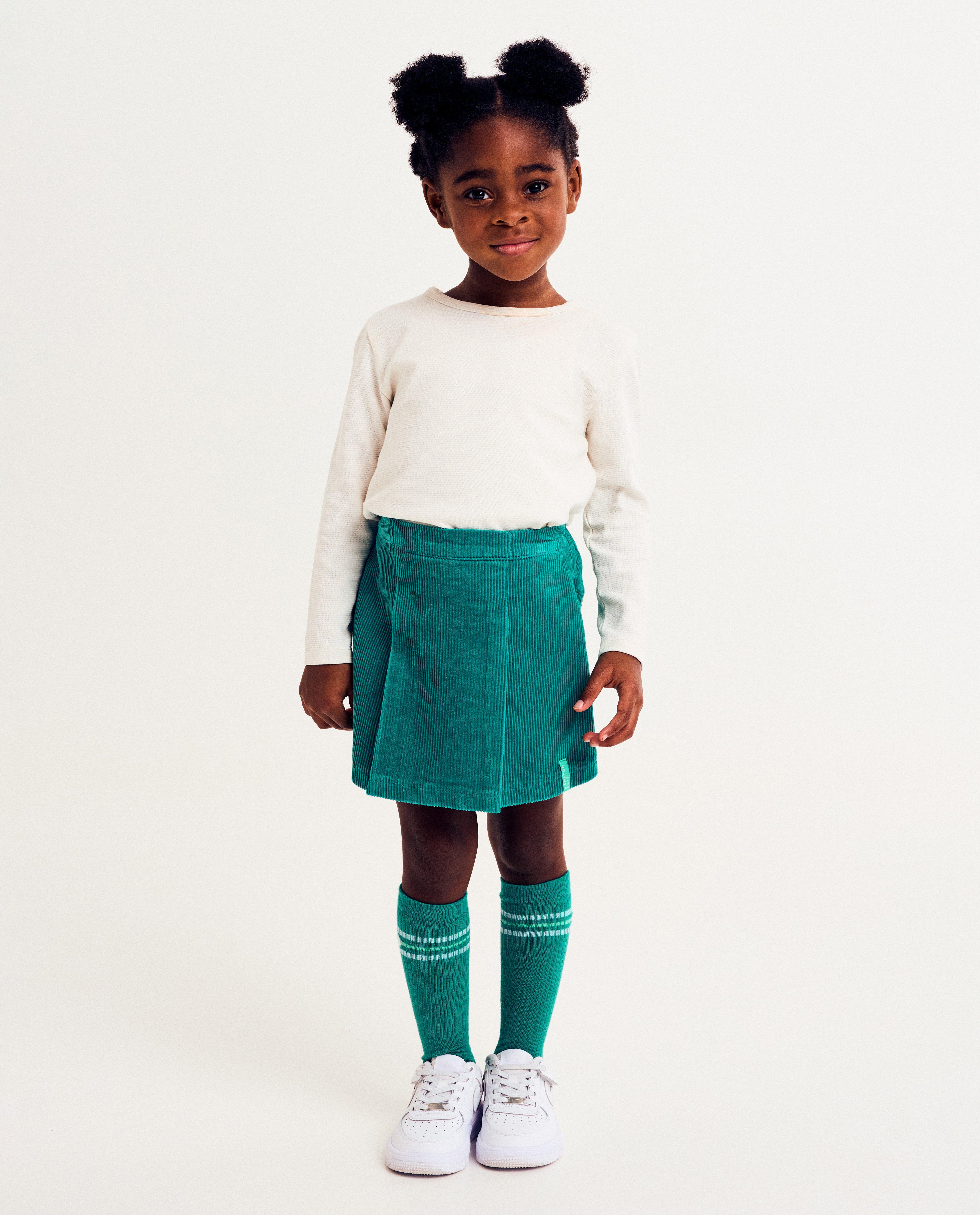 Groene skort van ribfluweel