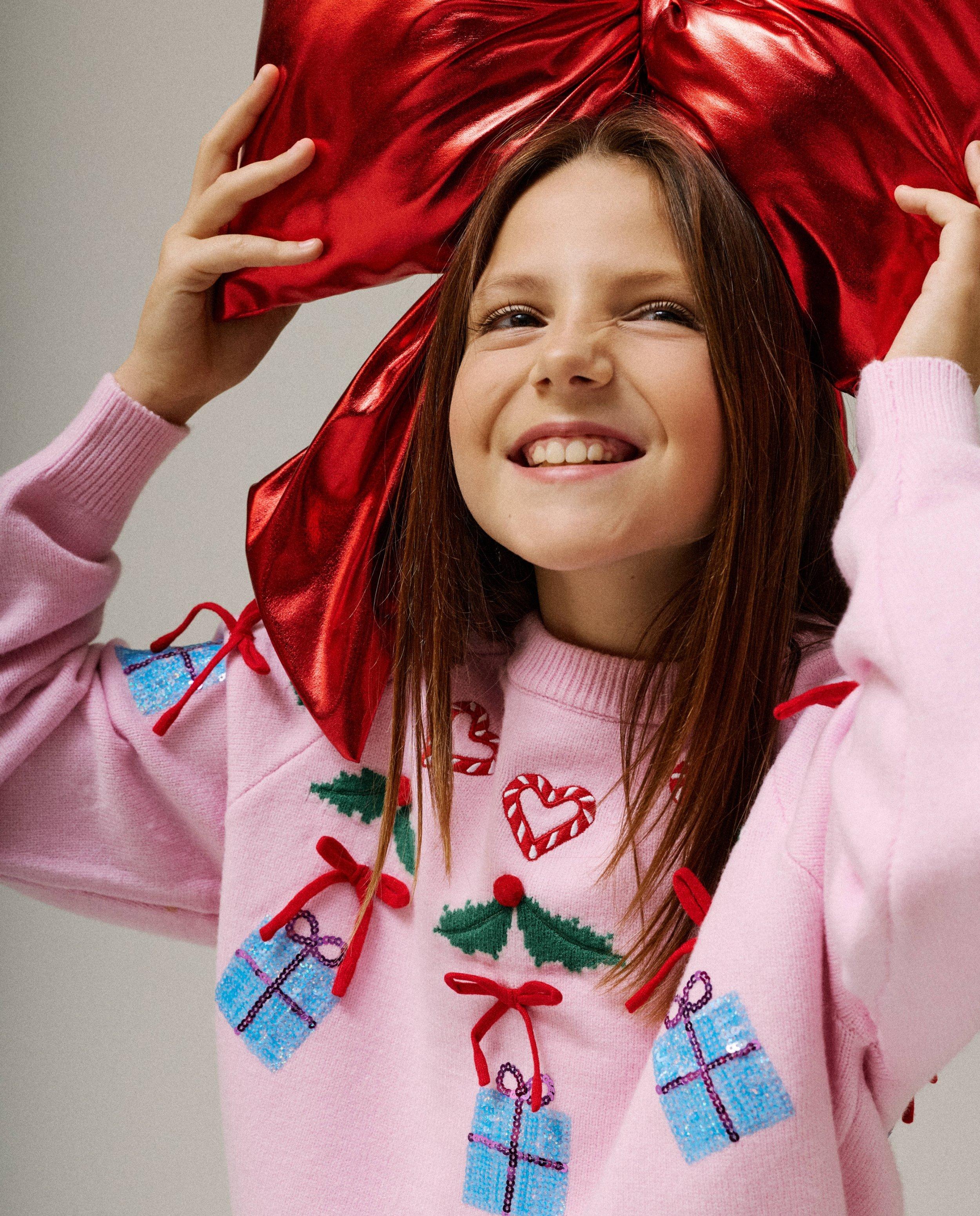 Pull de No&euml;l avec des petits n&oelig;uds - D&eacute;tails du produit - rose clair - image num&eacute;ro 1