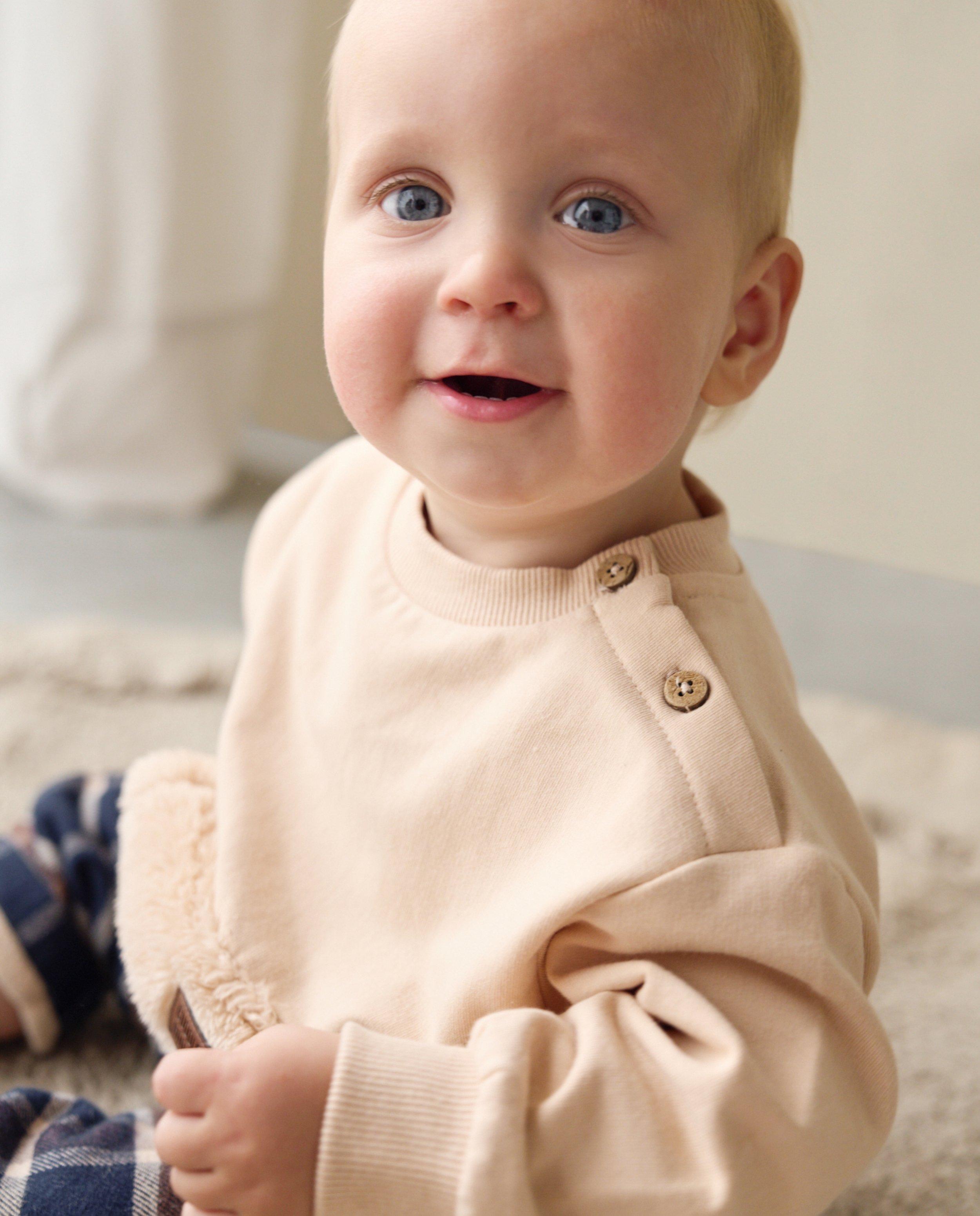 Sweater met teddy buidelzak