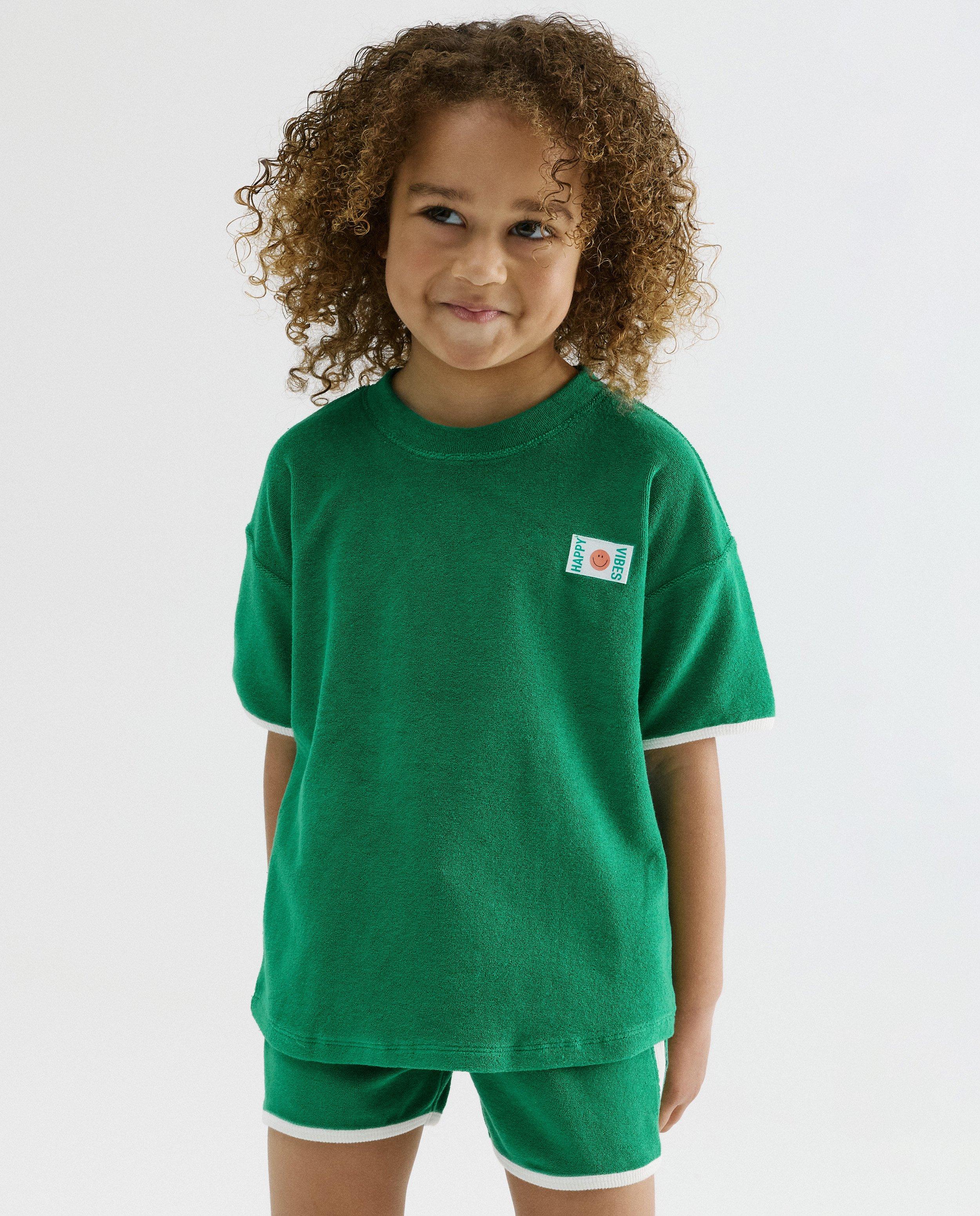 T-shirt avec label textile, coupe loose, 98-134